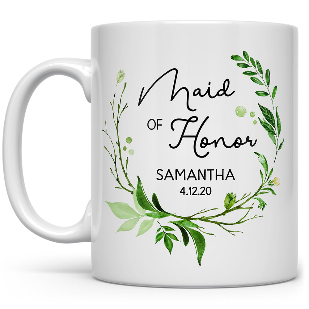White mug that says Maid of Honor with flowers, and a personalized name and date