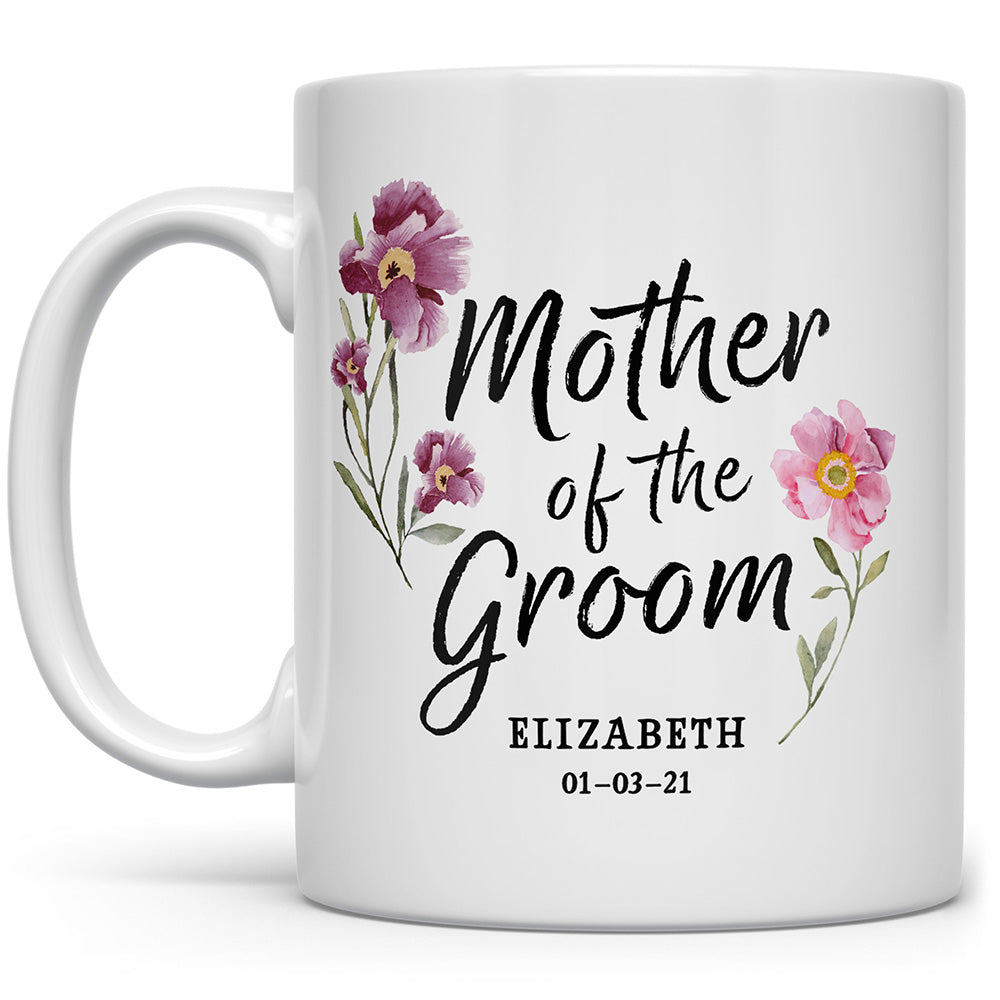 White mug that says Mother of the Groom with flowers, and a personalized name and date