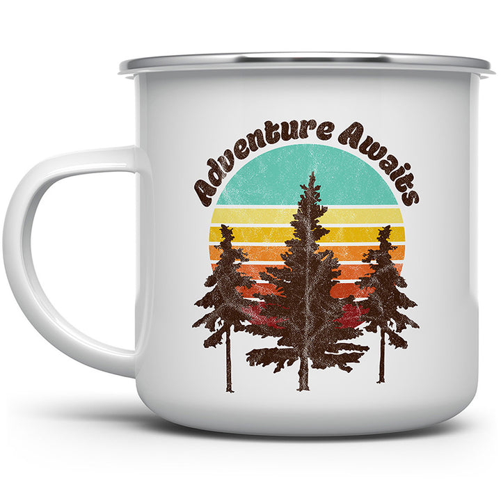 Camp mug with adventure awaits over sunset with 3 pine trees in front.