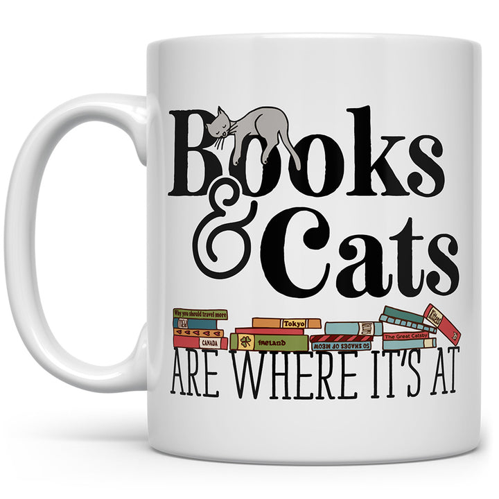Mug that says Books and Cats Are Where It's At with a cat and books on it