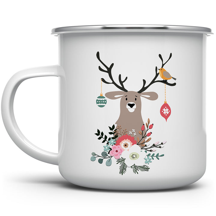 Mug with a picture of a reindeer with ornaments, birds, and flowers on it