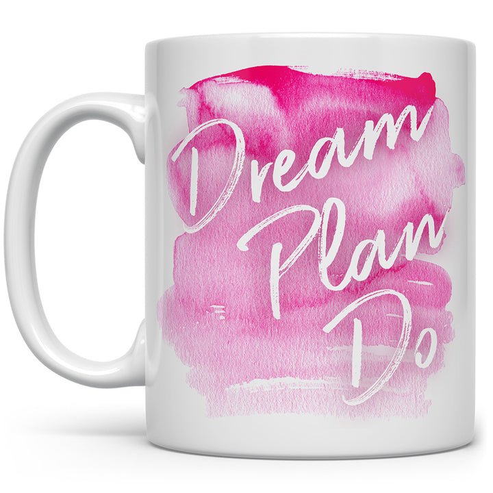 Mug that says Dream Plan Do with a pink paint streak mark