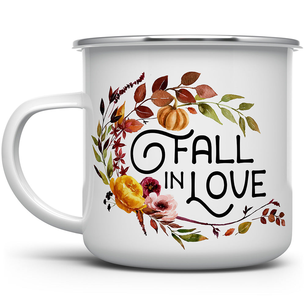 White mug that says Fall in Love with fall flowers and squash on it
