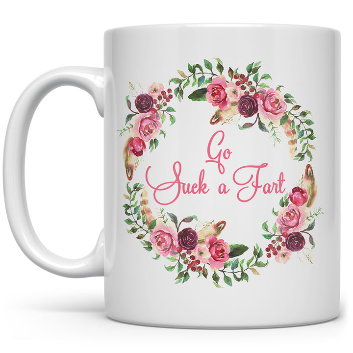 Mug that says Go Suck a Fart with flowers around it