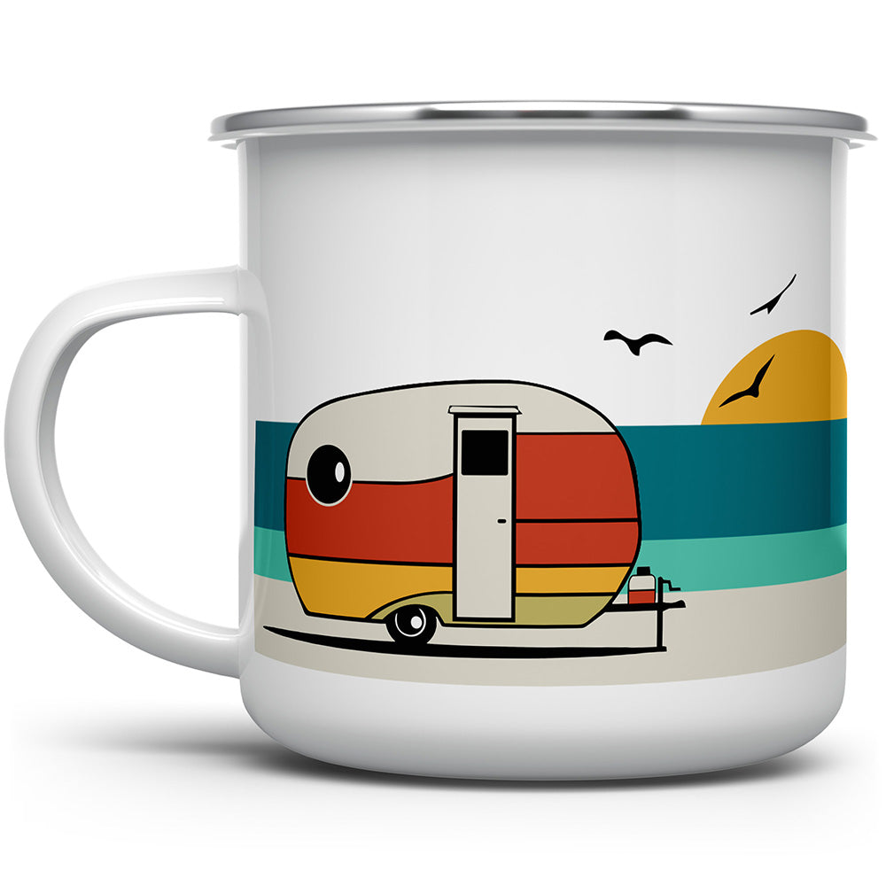 white camp mug with silver rim with a camper by the ocean and birds and the sun on it 