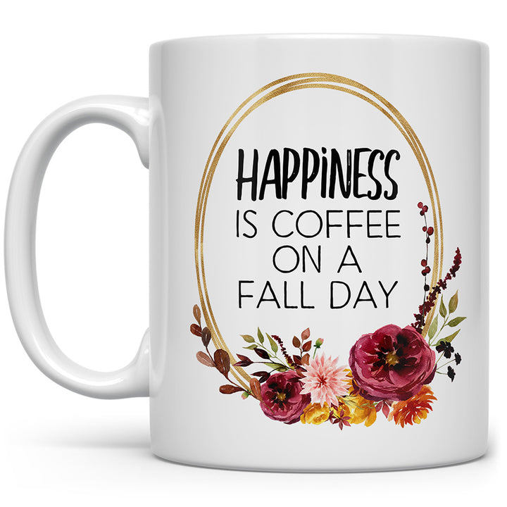 White mug that says Happiness is Coffee on a Fall Day with flowers
