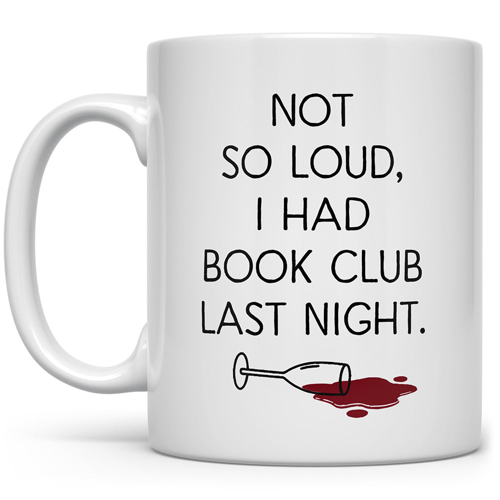 White mug that says Not so loud, I had book club last night with a spilled glass of wine on it