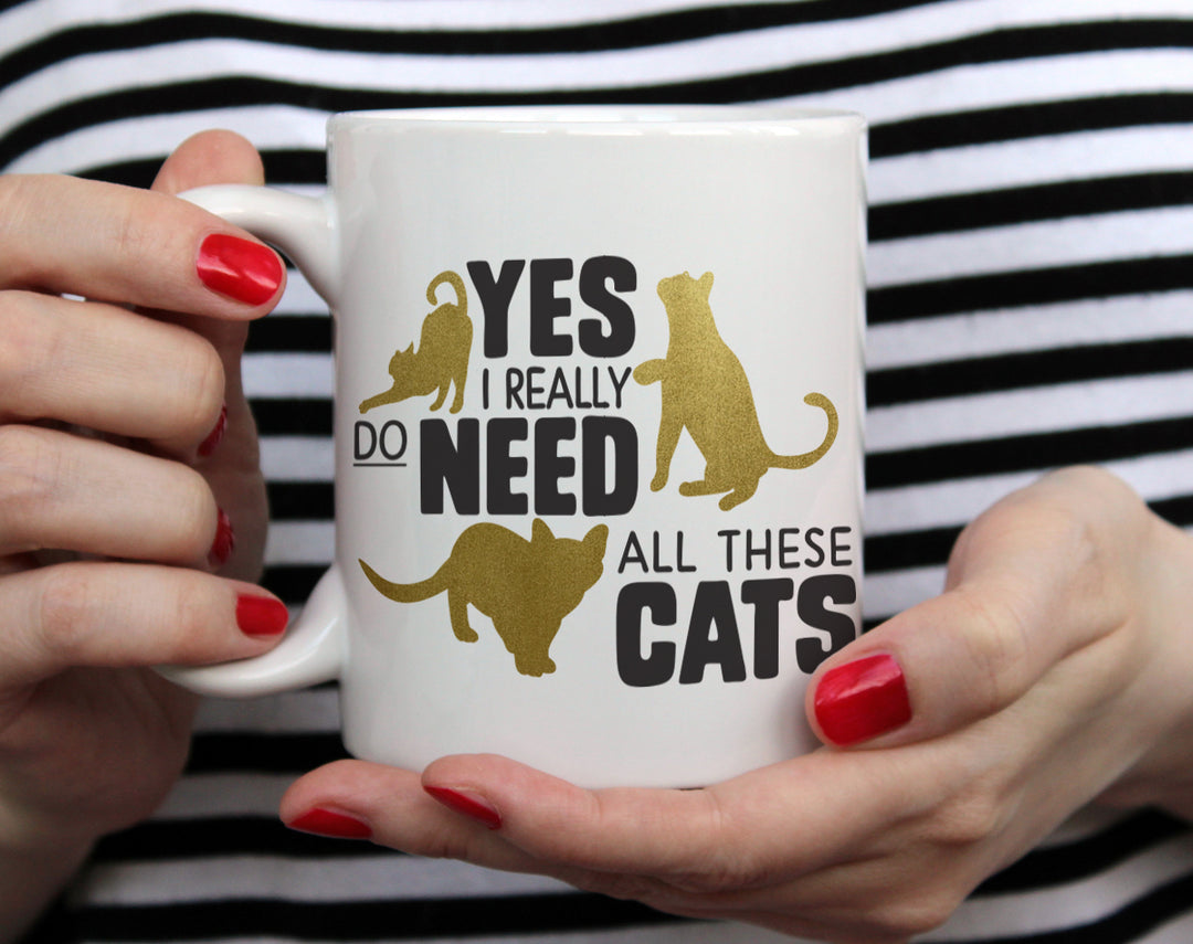 Yes Cats mug held by hands