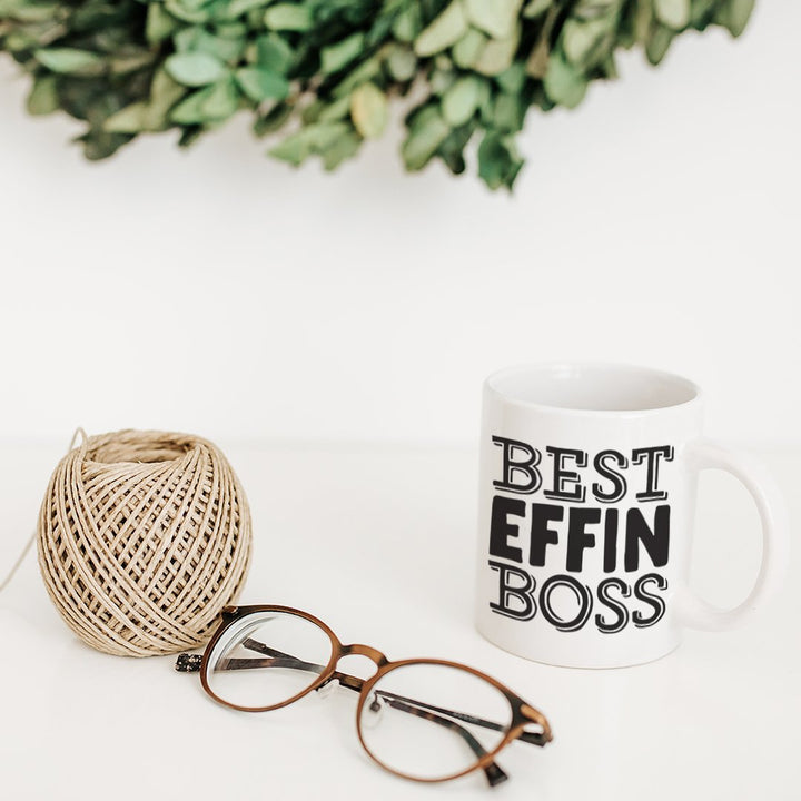 Best Effin Boss Mug  with glasses and string next to it