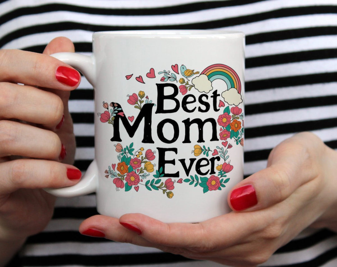 Best Mom Ever Mug Gift held by woman in black and white top with red nail polish