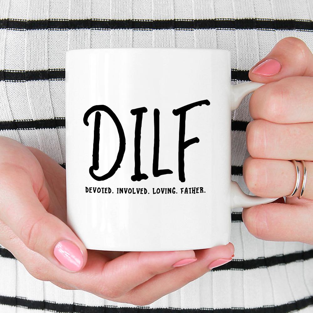 DILF Mug being held by woman wearing black and white striped top