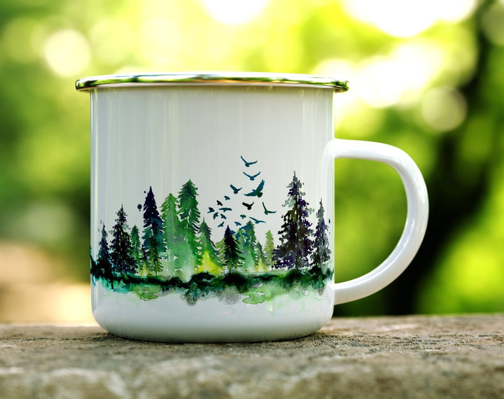 Camp mug with trees and birds on a log