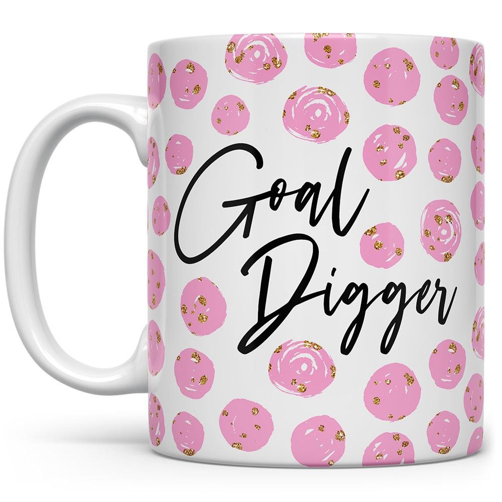 White mug that says Goal Digger with pink and gold spots on a white background