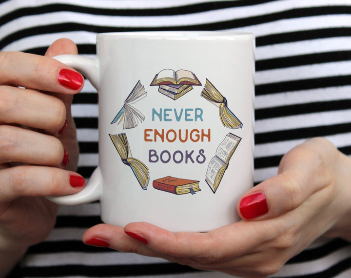 Never Enough Books Mug held by hands - Loftipop