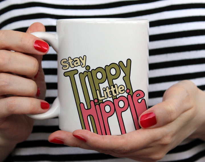 Stay Trippy Little Hippie Mug held by hands - Loftipop
