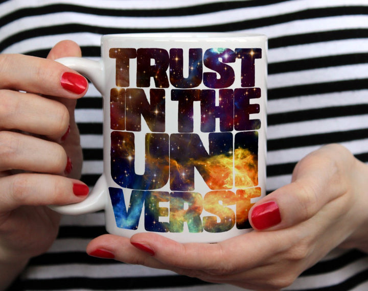 Trust in the Universe Mug held by hands - Loftipop